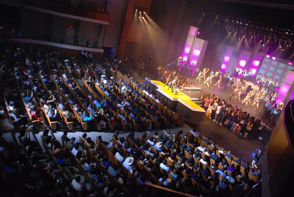 A full house in a dark theater with lit up stage for Univision Austin's Premios Texas awards event in 2011.