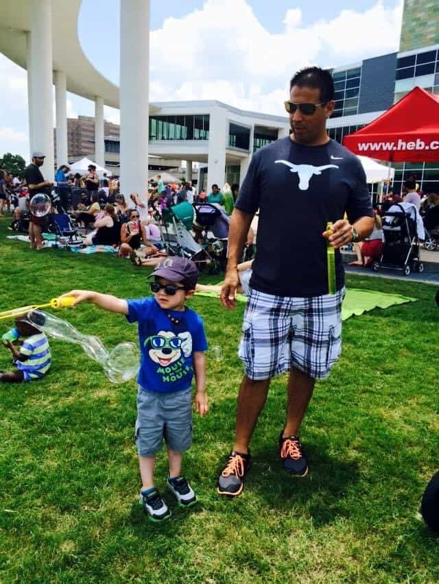 father and son having a great time Long Center's Bubblepalooza