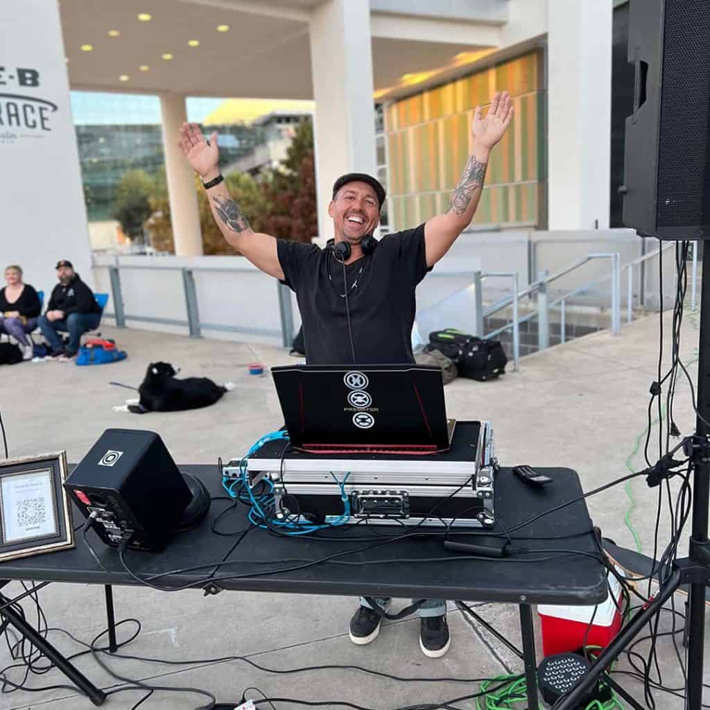 Donavin with his DJ setup outside on Long Center's H-E-B Terrace